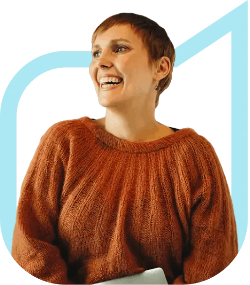 Smiling woman holding laptop